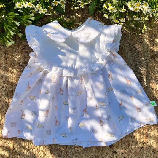 Vestito bambina in cotone con rouches ricamate e bottoni in madreperla