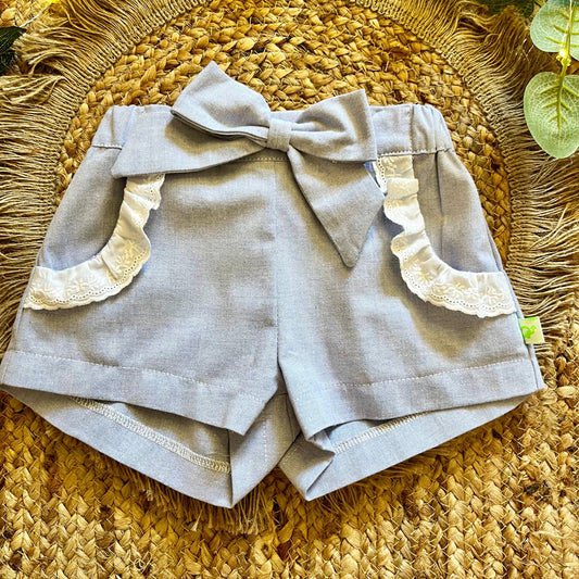 Short bambina elegante in Oxford celeste con ruches e elastico in vita